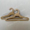 Cardboard hangers made from FSC renewable kraft paperboard, recyclable and fully biodegradable, suitable for displaying children's clothing tops and pants